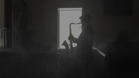 Free Stock Video Saxophonist Silhouette Playing Music In A Dark Room Live Wallpaper - Free Live Wallpaper