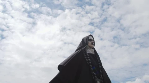 Free Stock Video Scary Ghost Nun Outside On A Sunny Day Live Wallpaper - Free Live Wallpaper