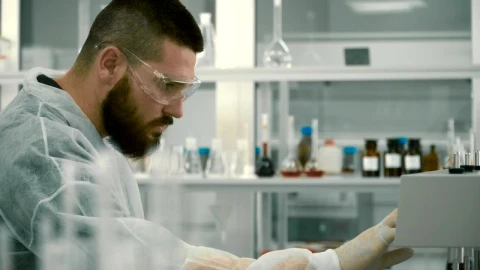 Free Stock Video Scientist Adjusting Equipment In A Laboratory Live Wallpaper - Free Live Wallpaper
