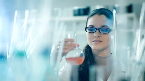 Free Stock Video Scientist Looks At A Liquid In A Conical Flask Live Wallpaper - Free Live Wallpaper