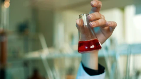 Free Stock Video Scientist Shaking A Conical Flask In The Laboratory Live Wallpaper - Free Live Wallpaper