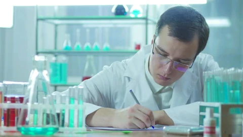 Free Stock Video Scientist Writing In The Lab Live Wallpaper - Free Live Wallpaper
