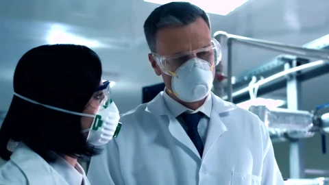 Free Stock Video Scientists Wearing A Face Mask Talking In The Lab Live Wallpaper - Free Live Wallpaper