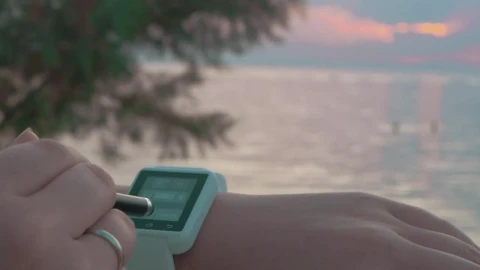 Free Stock Video Setting Up A Smartwatch At The Beach Live Wallpaper - Free Live Wallpaper