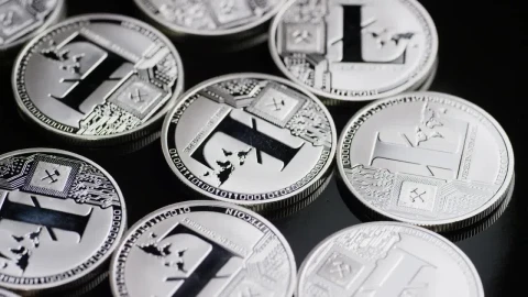 Free Stock Video Shiny Lite Coins Rotating On A Black Surface Live Wallpaper - Free Live Wallpaper