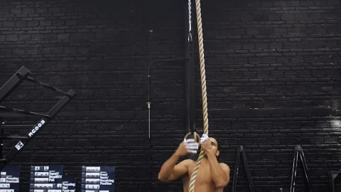 Free Stock Video Shirtless Man Rope Climbing At The Gym Live Wallpaper - Free Live Wallpaper
