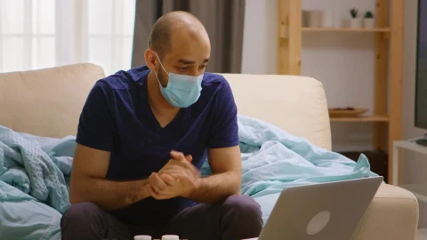 Free Stock Video Sick Man Chats On Video Call From Couch At Home Live Wallpaper - Free Live Wallpaper