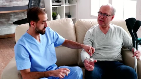 Free Stock Video Sick Man Chats With Nurse Giving Him Medication Live Wallpaper - Free Live Wallpaper