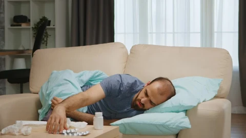 Free Stock Video Sick Man Lays On Sofa And Looks At Medication Live Wallpaper - Free Live Wallpaper