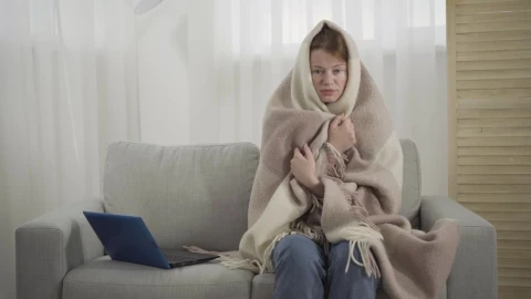 Free Stock Video Sick Woman Sneezes On Sofa While Wrapped In Blanket Live Wallpaper - Free Live Wallpaper
