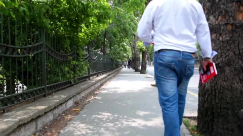 Free Stock Video Sidewalk In A City With A Couple Of People Walking Live Wallpaper - Free Live Wallpaper