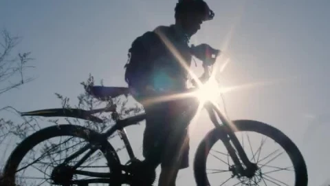 Free Stock Video Silhouette In Front Of The Sun Of A Cyclist Outdoors Live Wallpaper - Free Live Wallpaper