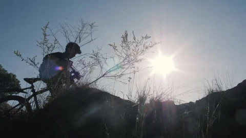 Free Stock Video Silhouette Of A Cyclist In Front Of The Sun In Live Wallpaper - Free Live Wallpaper