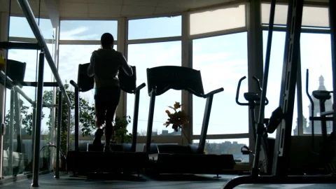 Free Stock Video Silhouette Of A Woman Running In The Treadmill Live Wallpaper - Free Live Wallpaper