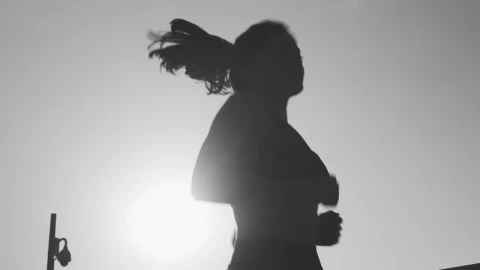 Free Stock Video Silhouette Of A Young Woman Jogging In Front Of The Live Wallpaper - Free Live Wallpaper