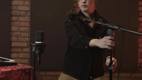Free Stock Video Singer Arranging Her Microphones In A Recording Studio Live Wallpaper - Free Live Wallpaper
