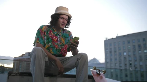 Free Video Stock Skater Using His Phone In The City Live Wallpaper - Free Live Wallpaper