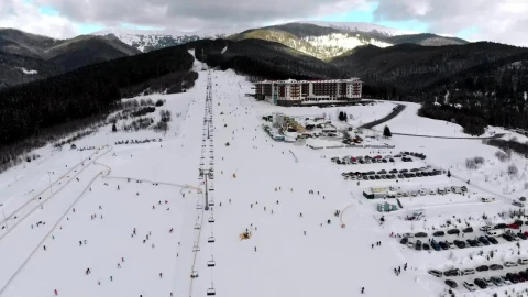 Free Video Stock Ski Resort And Skiers Going Down The Mountain Live Wallpaper - Free Live Wallpaper
