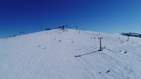 Free Video Stock Skiers On A Practice Mountain Aerial View Live Wallpaper - Free Live Wallpaper