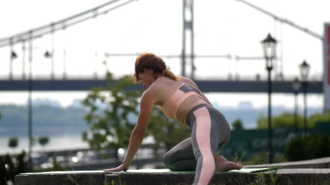 Free Video Stock Skillful Woman Doing A Complex Yoga Pose Live Wallpaper - Free Live Wallpaper