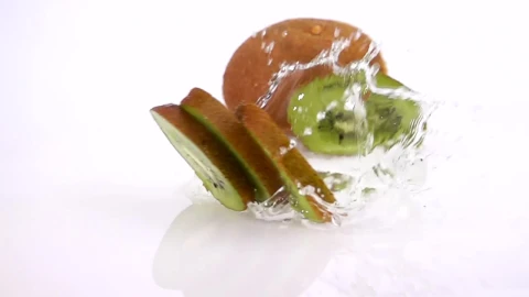 Free Video Stock Slices Of Kiwi Falling Into Water On White Background Live Wallpaper - Free Live Wallpaper