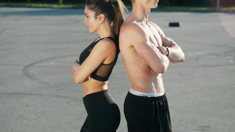 Free Video Stock Slim Woman And Shirtless Man Stand Back To Back Live Wallpaper - Free Live Wallpaper
