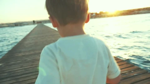Free Video Stock Small Boy Running Along A Pier Live Wallpaper - Free Live Wallpaper