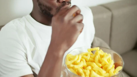 Free Video Stock Smiling Man Watches Movie And Eats Snacks Live Wallpaper - Free Live Wallpaper