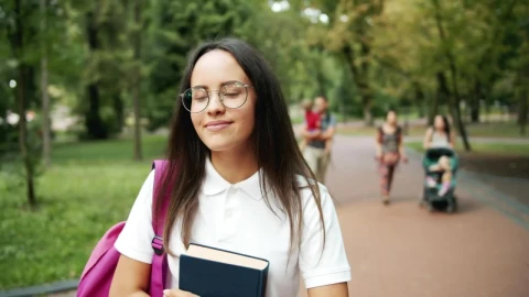 Free Video Stock Smiling Student Inspired By Nature In Park Live Wallpaper - Free Live Wallpaper