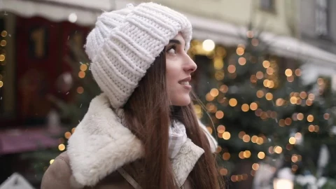 Free Video Stock Smiling Woman Enjoys Winter Snowflakes In Street Live Wallpaper - Free Live Wallpaper