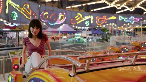Free Video Stock Smiling Woman Sitting On An Orange Fair Game Live Wallpaper - Free Live Wallpaper