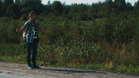Free Video Stock Smoking Man Hitchhiking In A Rural Area Live Wallpaper - Free Live Wallpaper