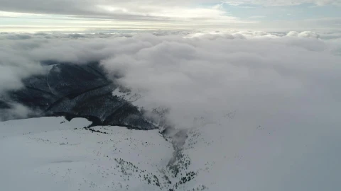 Free Video Stock Snowy Relief Covered By Clouds From Above Live Wallpaper - Free Live Wallpaper