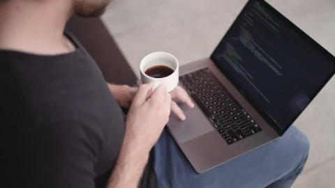 Free Video Stock Software Developer Holding A Coffee Cup Live Wallpaper - Free Live Wallpaper