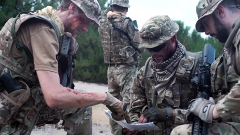 Free Video Stock Soldiers Discussing Where To Go On The Map Live Wallpaper - Free Live Wallpaper