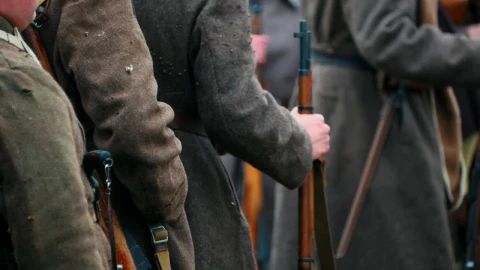 Free Video Stock Soldiers In Coats Standing In A Row Holding Guns Live Wallpaper - Free Live Wallpaper