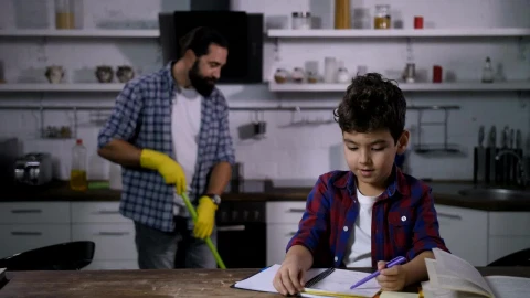 Free Video Stock Son Doing Homework While His Father Cleans Live Wallpaper - Free Live Wallpaper