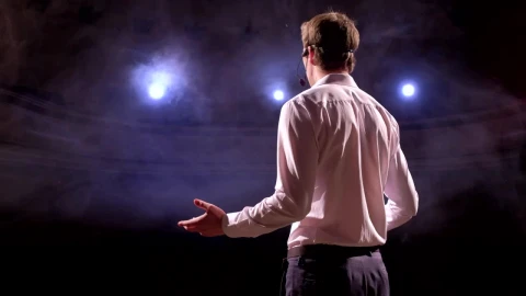 Free Video Stock Speaker Gives A Talk In An Auditorium Live Wallpaper - Free Live Wallpaper
