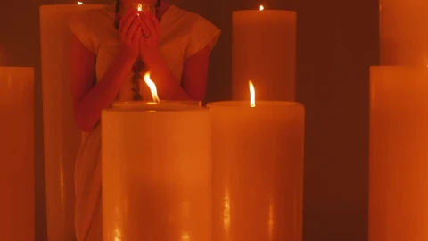 Free Video Stock Spiritual Woman Meditating Among Many Candles Live Wallpaper - Free Live Wallpaper
