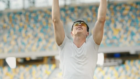 Free Video Stock Sports Race Winner Raises Hands In Victory Live Wallpaper - Free Live Wallpaper