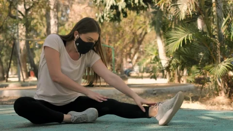 Free Video Stock Sportswoman Stretching With A Face Mask Live Wallpaper - Free Live Wallpaper