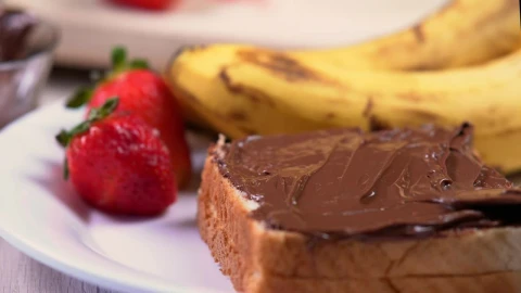 Free Video Stock Spreading Hazelnut Cream On White Bread Live Wallpaper - Free Live Wallpaper