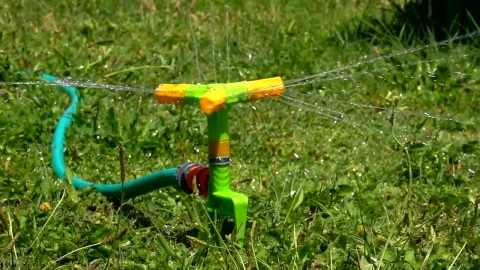 Free Video Stock Sprinkler Watering The Grass Live Wallpaper - Free Live Wallpaper