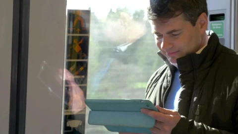 Free Video Stock Standing On A Train With A Tablet Live Wallpaper - Free Live Wallpaper