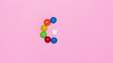 Free Video Stock Star Candy Surrounded By Chocolates On A Pink Background Live Wallpaper - Free Live Wallpaper