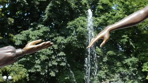 Free Video Stock Statue Reaching Towards Another Live Wallpaper - Free Live Wallpaper