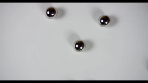 Free Video Stock Steel Pellets Rolling On White Surface Live Wallpaper - Free Live Wallpaper
