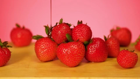 Free Video Stock Strawberries Are Covered In Chocolate On A Pink Background Live Wallpaper - Free Live Wallpaper