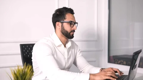 Free Video Stock Stressed Man Works On Laptop In Minimalist Office Live Wallpaper - Free Live Wallpaper
