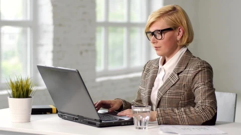 Free Video Stock Stressed Woman Treats Headache While Working On Laptop Live Wallpaper - Free Live Wallpaper